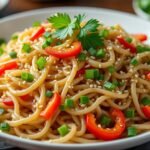 Nouilles de riz sautées à l’ail et sésame